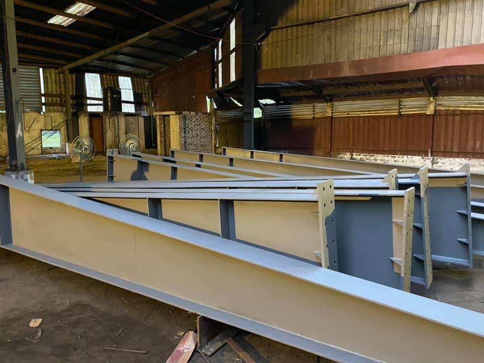 Precision steel beam cutting and assembly workshop